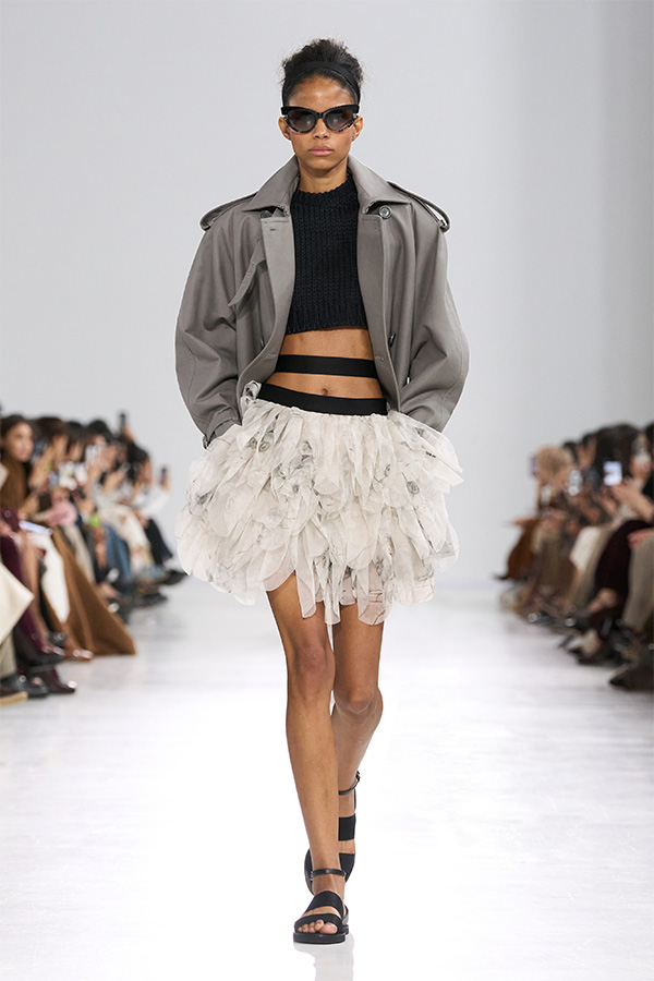 Max Mara Spring/Summer 2026 Fashion Show - Look with Grey Cropped Trench Coat and White Skirt.